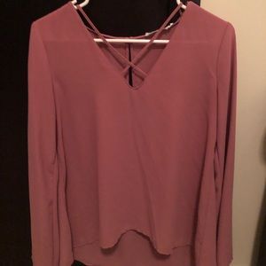 Long sleeve lush top. Criss cross on chest